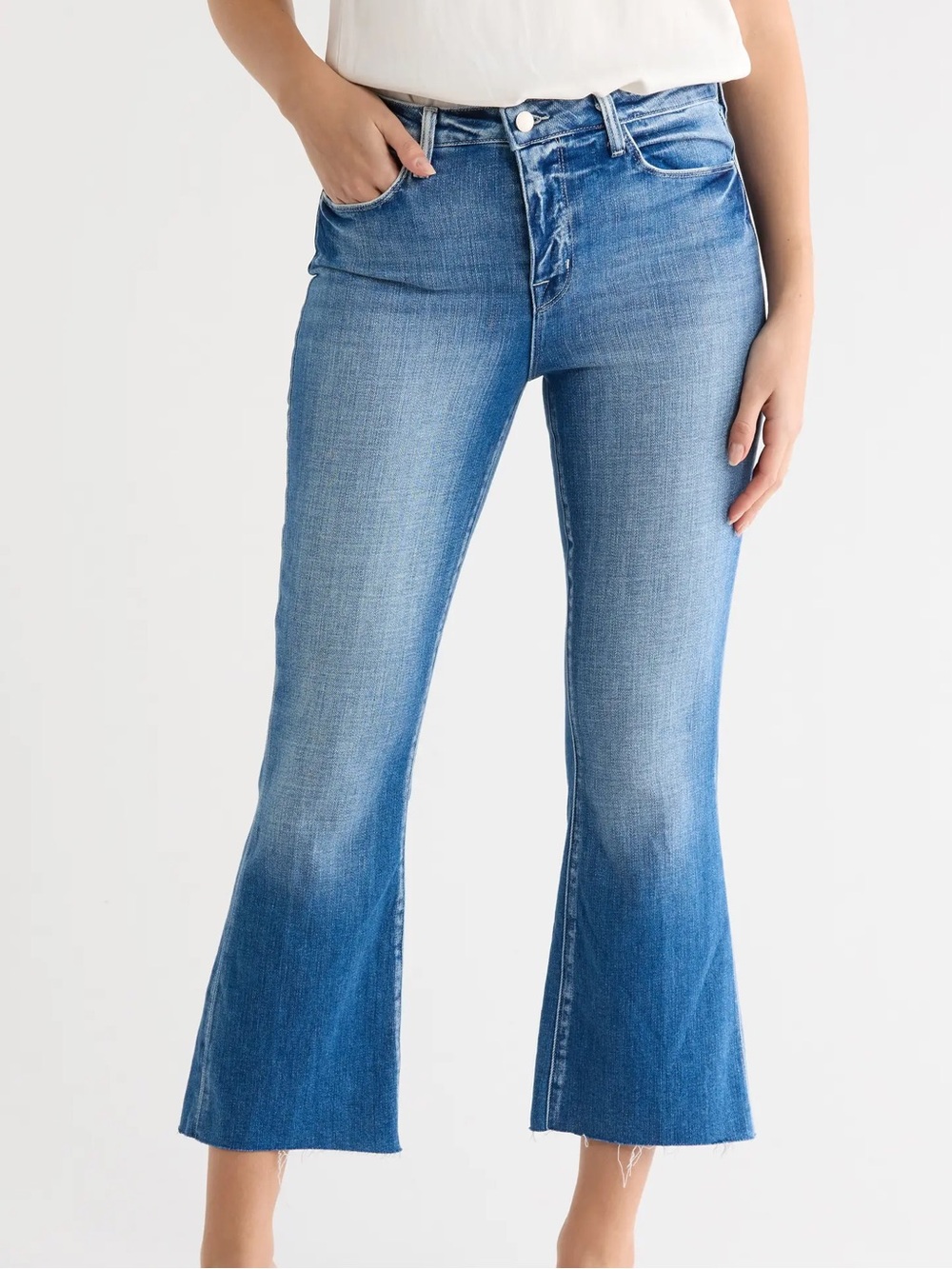 L'AGENCE Medium Blue Flare Jeans with Raw Hem